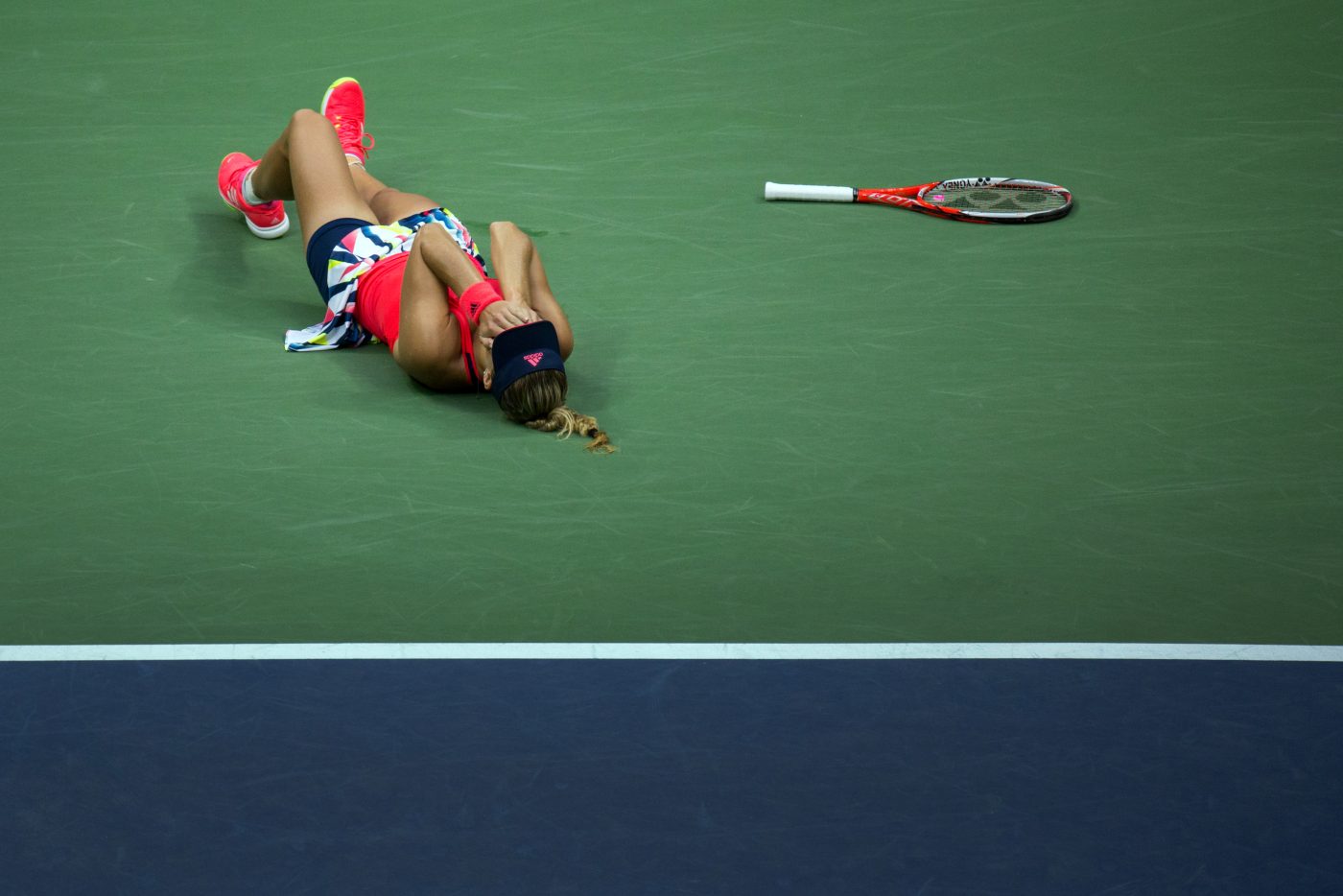 Angelique Kerber falls to the court after defeating Karolina Pliskova for the women's singles championship at the U.S. Open in Flushing on Sept. 10, 2016.
